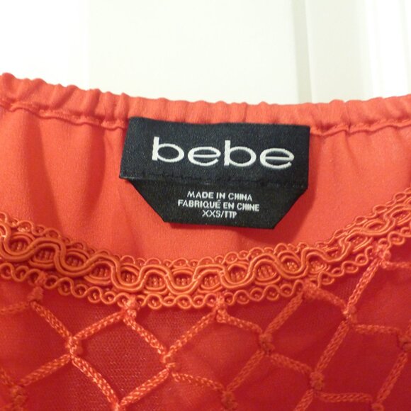BEBE bright orange satin top with tassels and bubble hem - Picture 5 of 11